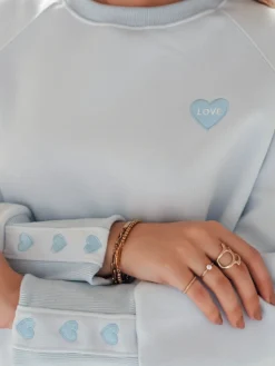 Bluzy Damskie>Dstreet Bluza damska oversize z sercami LOVELISA niebieska BY1519